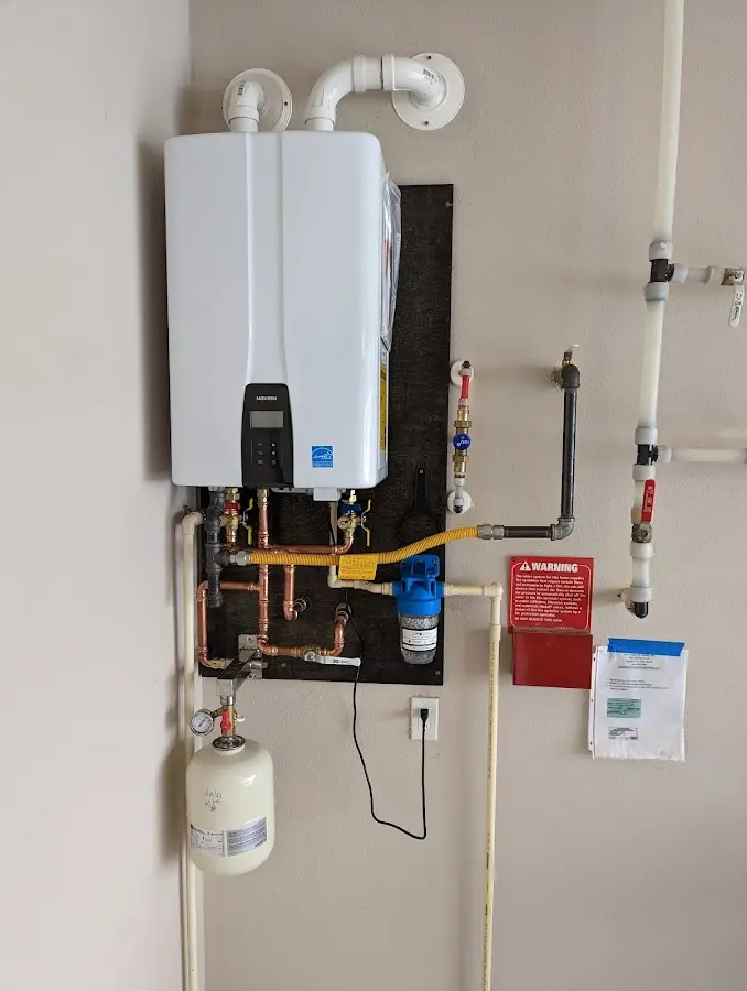 Professional plumber installing copper piping in a Fairwood home